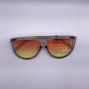 woman’s large orange glasses